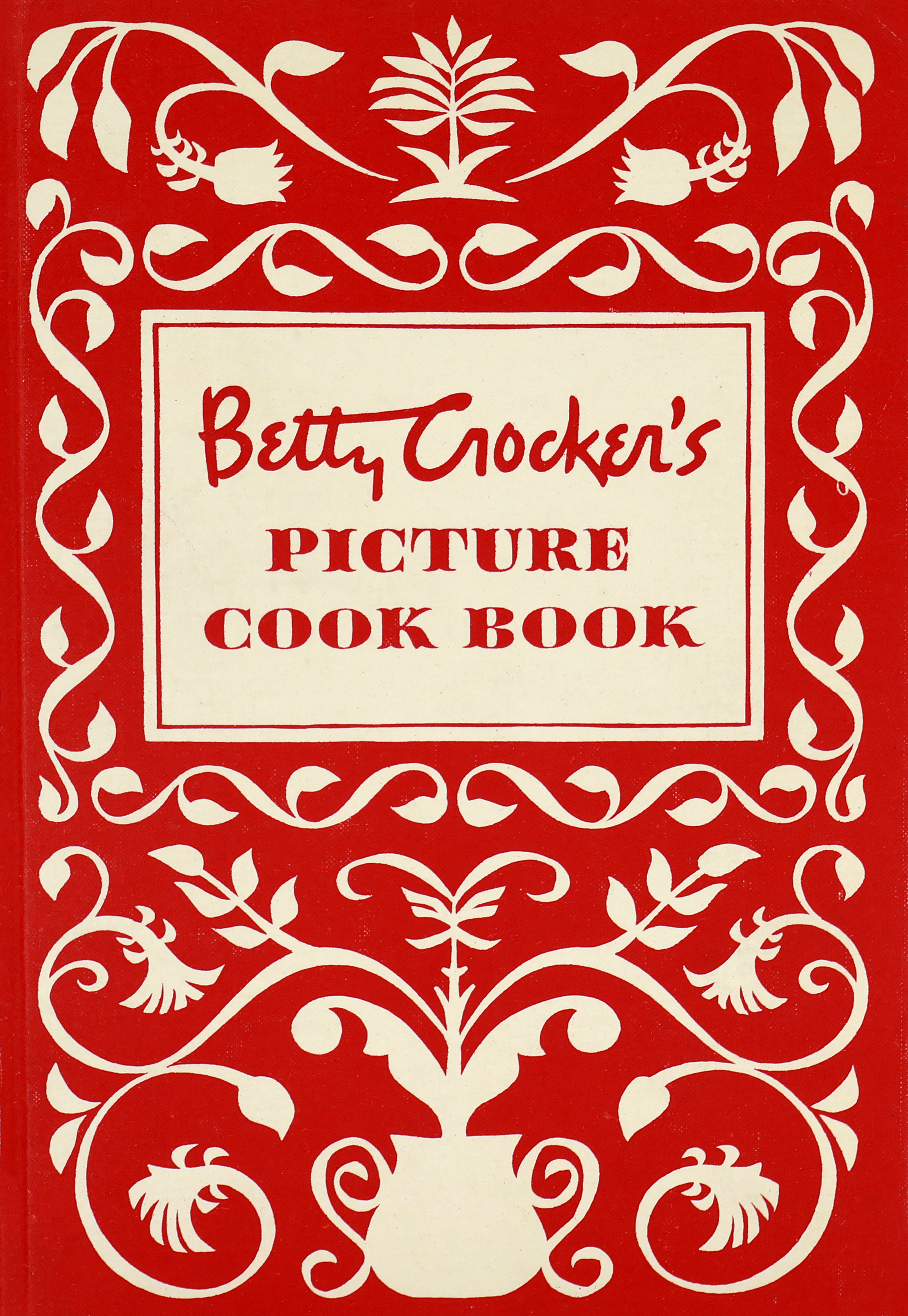 o	Cover of the 1950 Betty Crocker Cookbook that is red and white with Pennsylvania Dutch-looking scrolling artwork resembling a pot with vines and flowers growing out of it.